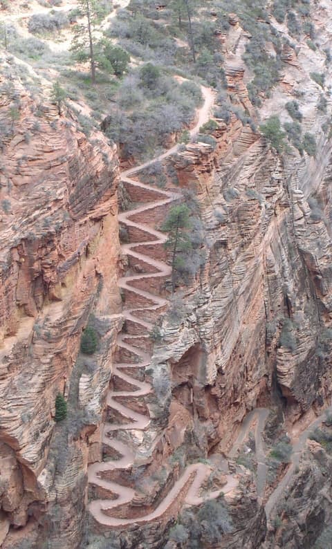 Dramatic switchbacks on the West Rim Trail zigzag up steep red sandstone cliffs in Zion National Park.